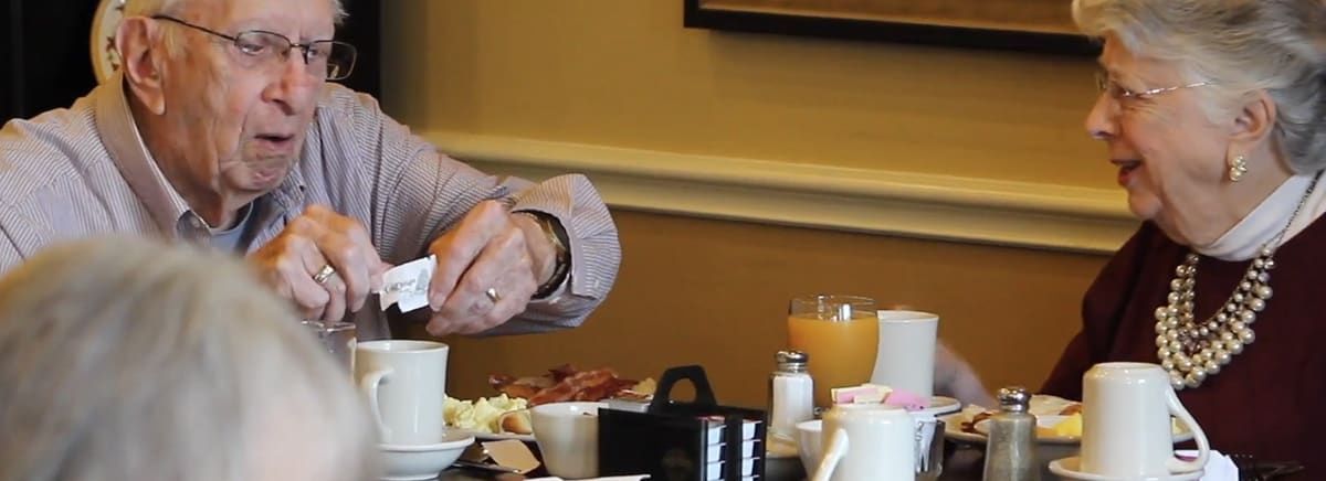 Senior couple having breakfast at affordable retirement community